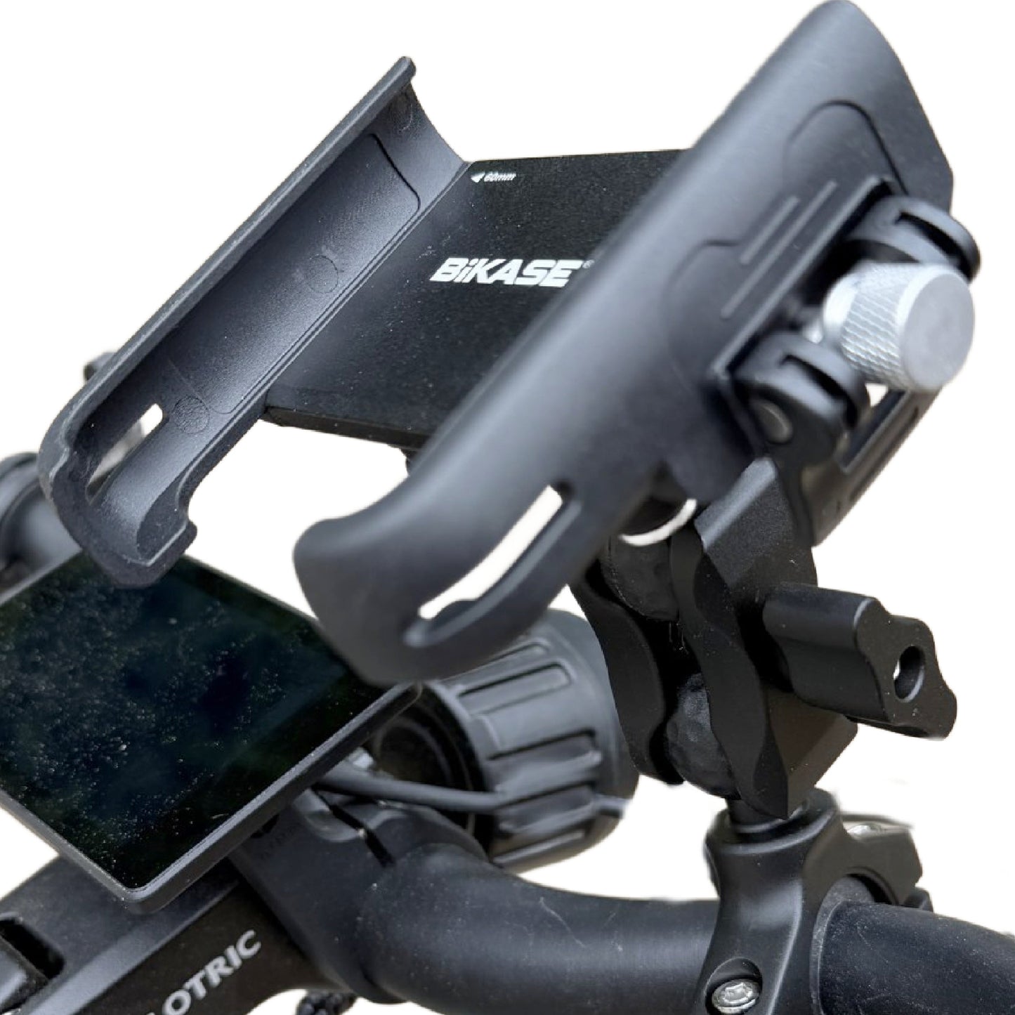 IsoKASE phone holder mounted on ebike handlebars with a phone in place