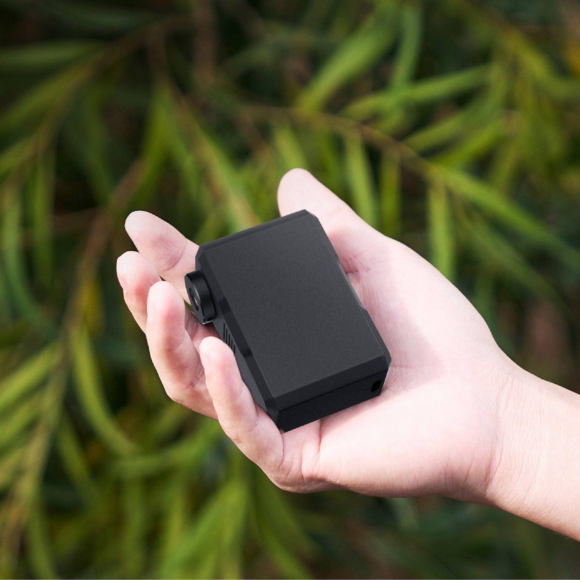 Nano mini tire inflator shown in the palm of a hand